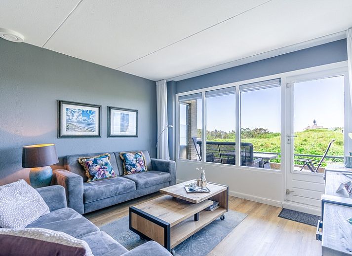 Cozy living room in Apartment Juliana 042 with beautiful views of nature in De Koog, Texel, Wadden Islands.