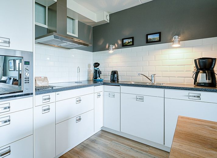 Stylish living room of Apartment Juliana 042 overlooking De Koog, Texel, ideal for a relaxing stay.