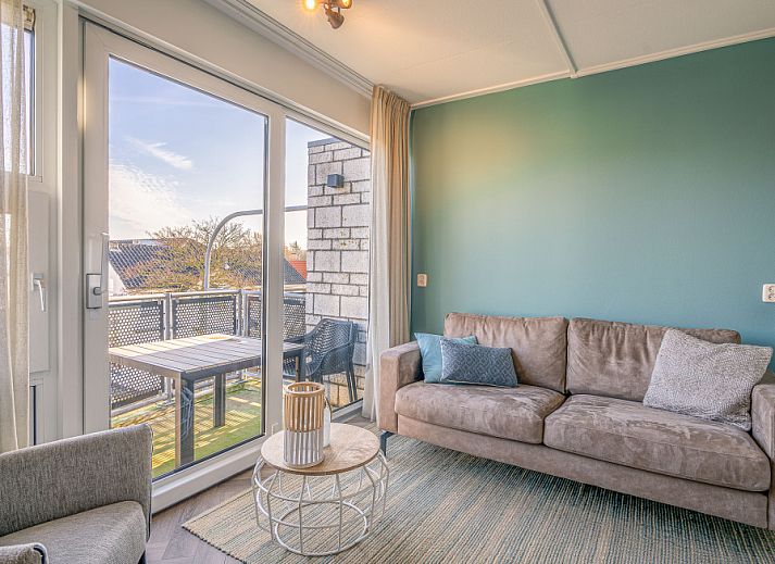 Cozy living room overlooking terrace in Apartment Zeedistel 24, De Koog, Texel.