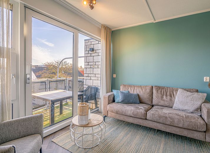 Cozy living room overlooking terrace in Apartment Zeedistel 24, De Koog, Texel.