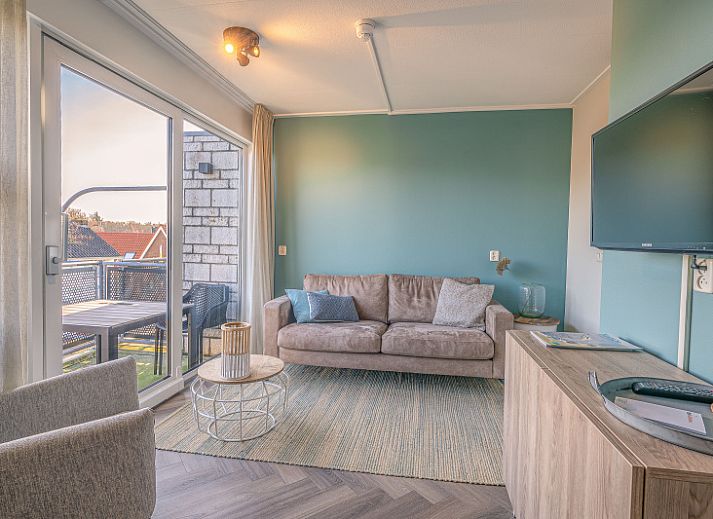 Cozy living room overlooking terrace in Apartment Zeedistel 24, De Koog, Texel.