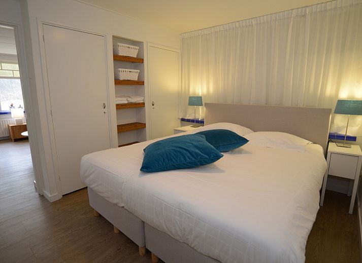 Exterior of Grand Hotel Opduin - Apartment C in De Koog, Texel, with charming architecture and cycling guests.