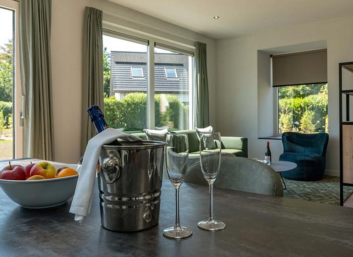 Charming vacation home Kluut 16a in De Koog, Texel with green surroundings.