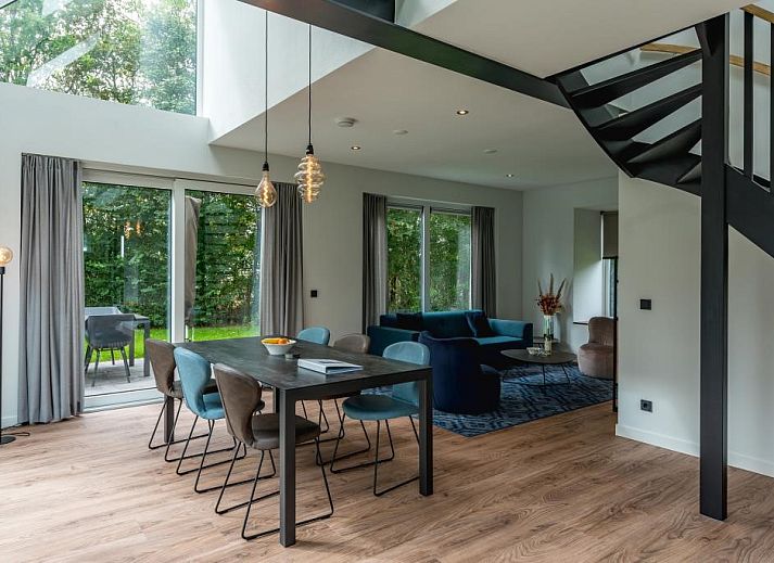 Charming vacation home Kluut 16a in De Koog, Texel with green surroundings.