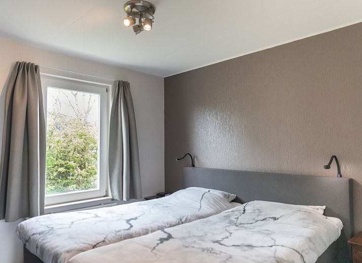 Spacious terrace at Stappeland - De Groene Boei vacation home in De Koog, Texel, ideal for outdoor dining.