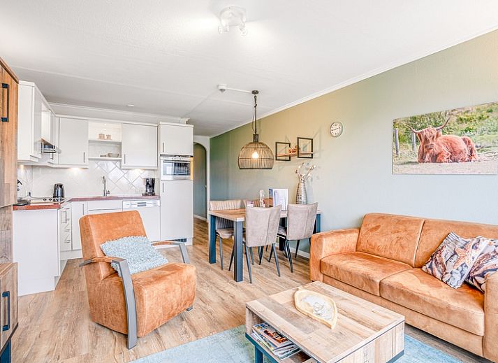 Cozy living room in Apartment Juliana 136 Island and Sea View, De Koog, Texel with a view of nature.