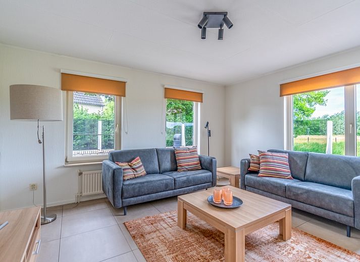 Vacation home Honeysuckle 69 with waterfront sauna in De Koog, Texel, surrounded by lush nature.