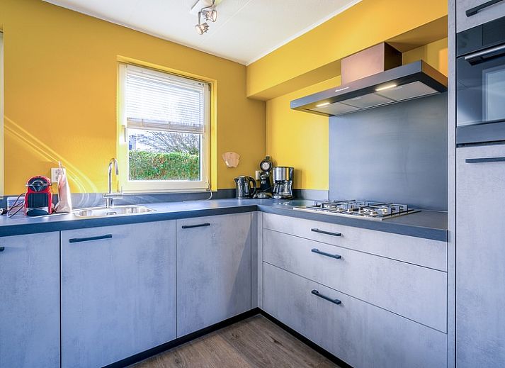 Cozy living room of Holiday home Kamperfoelie 87 in De Koog Texel with comfortable seating area.