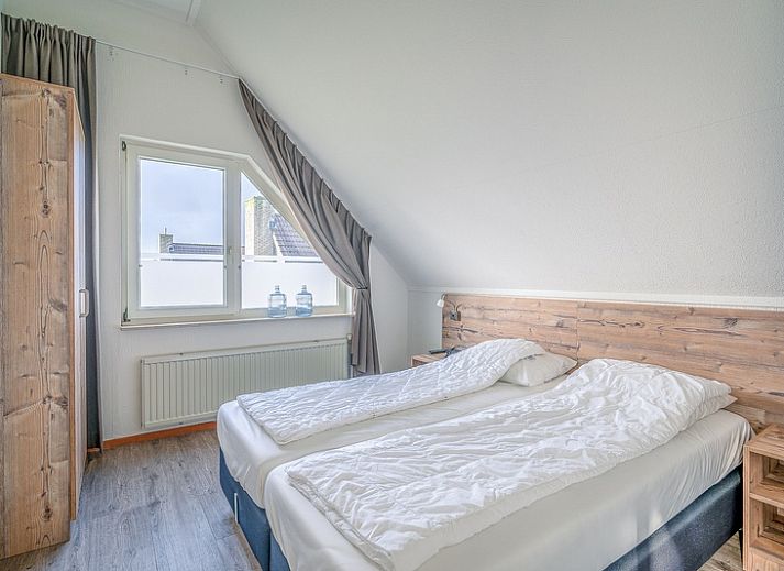 Cozy living room of Holiday home Kamperfoelie 87 in De Koog Texel with comfortable seating area.