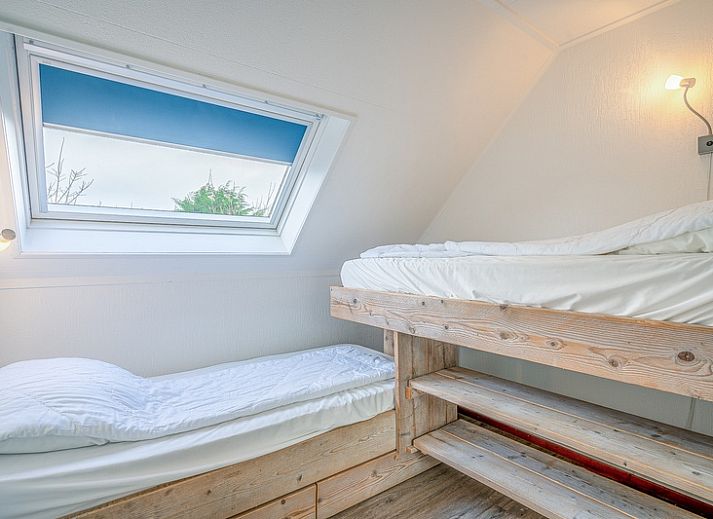 Cozy living room of Holiday home Kamperfoelie 87 in De Koog Texel with comfortable seating area.