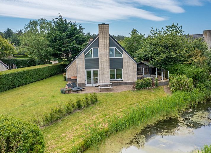 Vacation home Honeysuckle 71 in De Koog, Texel with spacious waterfront garden.