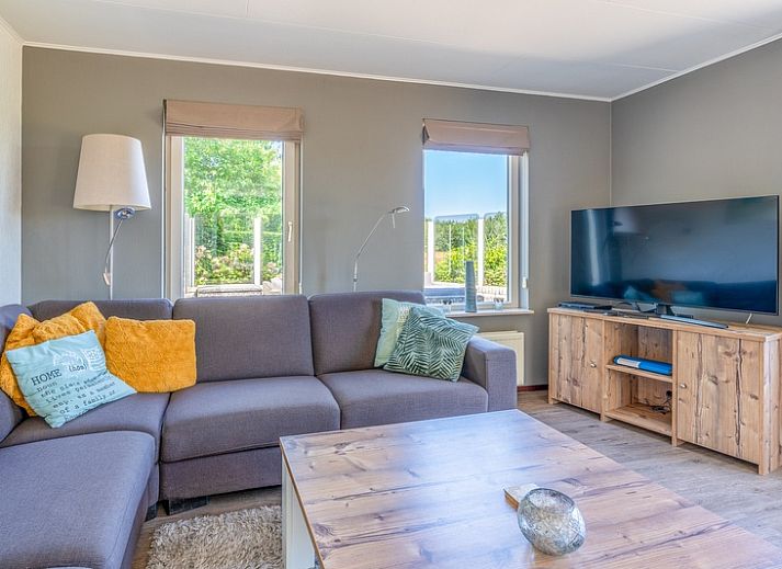 Vacation home Honeysuckle 71 in De Koog, Texel with spacious waterfront garden.