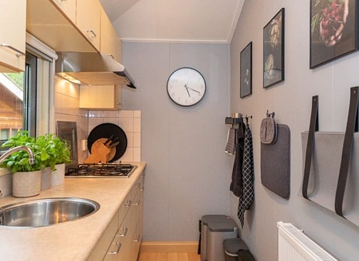 Vacation cottage in De Koog with inviting veranda and flowering garden, Texel, Wadden Islands.