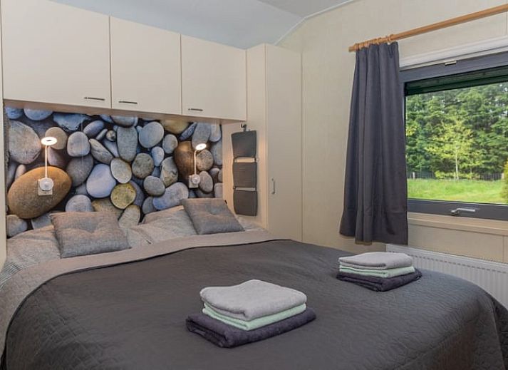 Vacation cottage in De Koog with inviting veranda and flowering garden, Texel, Wadden Islands.