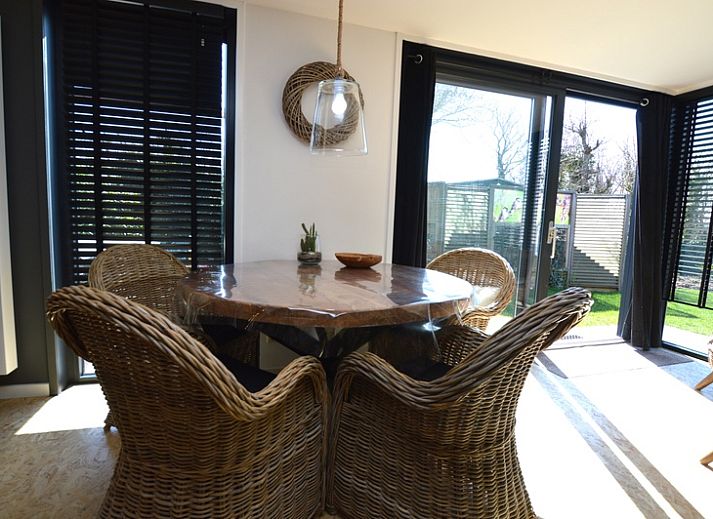 Spacious living room of Holiday home Hoog Koog 8 in De Koog Texel with lots of natural light.
