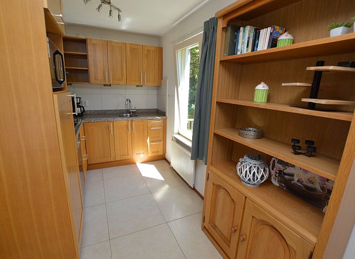 Spacious living room of Holiday home Stappeland 163, De Koog, Texel, with lots of natural light and comfortable furniture.