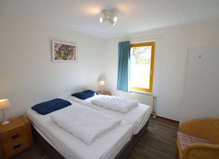 Spacious living room of Holiday home Stappeland 163, De Koog, Texel, with lots of natural light and comfortable furniture.