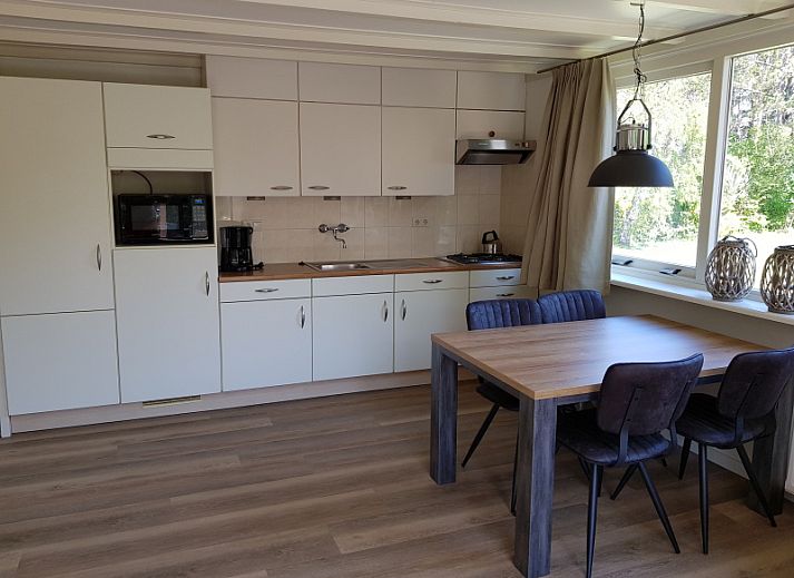 Bungalow 5100 in De Koog on Texel with sunny terrace and green surroundings.