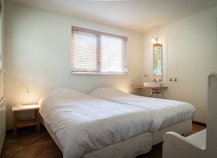 Spacious living room in Villa 6 persons with 2 bathrooms, De Koog, Texel. Comfortable sitting area and dining area in vacation home.