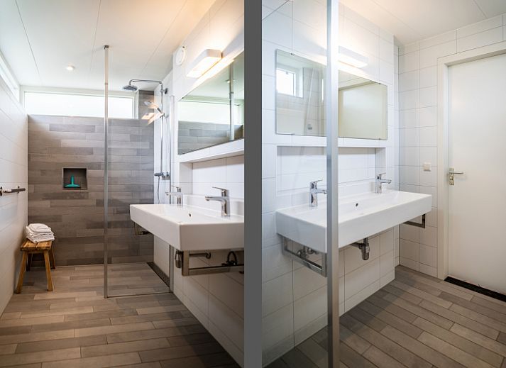 Spacious living room in Villa 6 persons with 2 bathrooms, De Koog, Texel. Comfortable sitting area and dining area in vacation home.