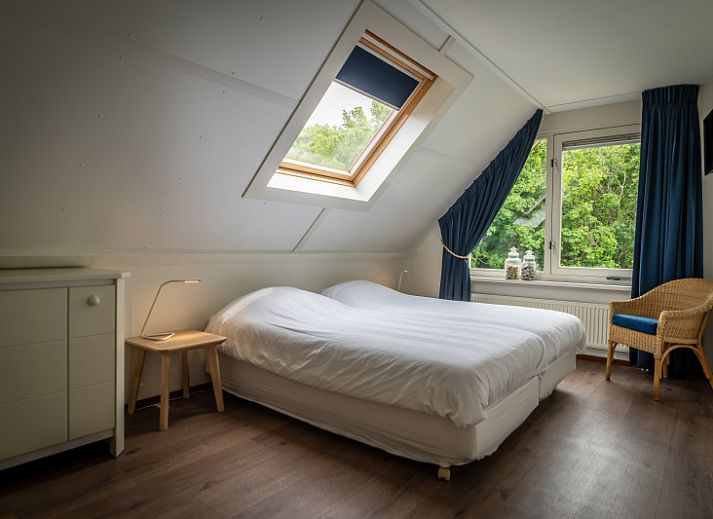 Spacious living room in Villa 6 persons with 2 bathrooms, De Koog, Texel. Comfortable sitting area and dining area in vacation home.