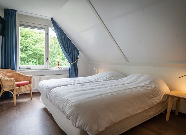 Spacious living room in Villa 6 persons with 2 bathrooms, De Koog, Texel. Comfortable sitting area and dining area in vacation home.