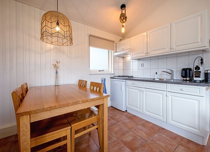 Spacious garden at Het Zandblauwtje vacation home in De Koog Texel