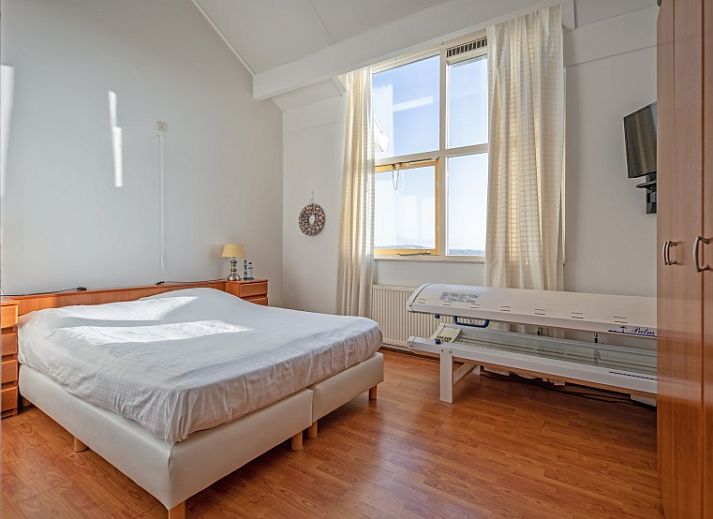 Cozy living room of Resort De Buteriggel - Apartment 9, De Koog, Texel with comfortable sofas and views of nature.