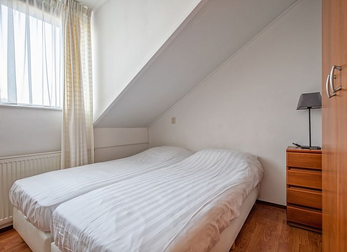 Cozy living room of Resort De Buteriggel - Apartment 9, De Koog, Texel with comfortable sofas and views of nature.