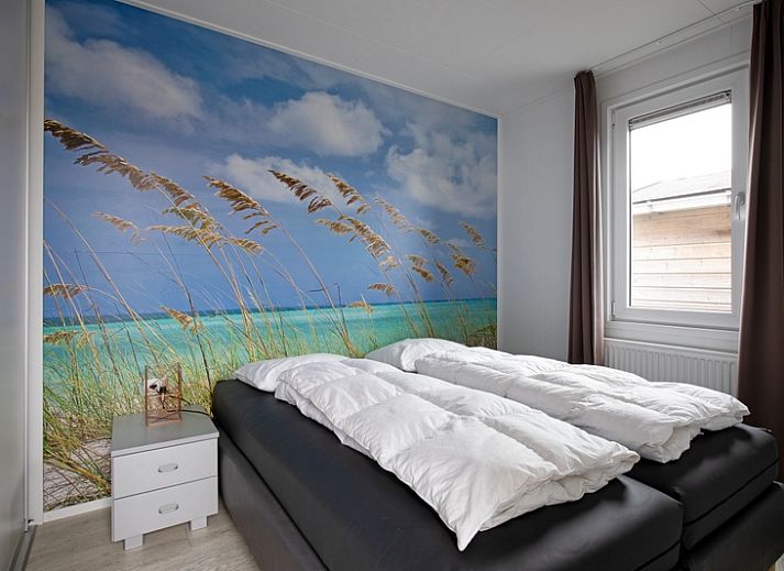 Exterior of Chalet Bregkoog 261, Chaletpark Bregkoog, De Koog, Texel. Modern architecture at sunset.