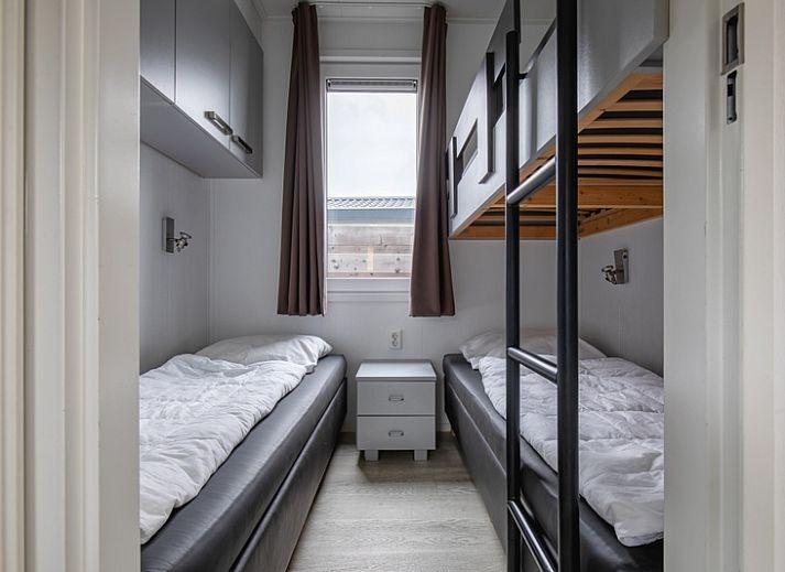 Exterior of Chalet Bregkoog 261, Chaletpark Bregkoog, De Koog, Texel. Modern architecture at sunset.