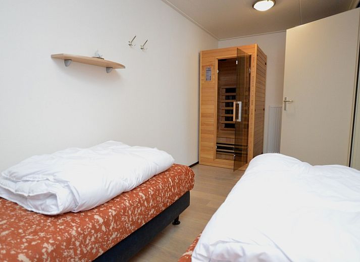 Cozy living room in Apartments Anna - Sun, De Koog, Texel, with comfortable seating area and lots of natural light.