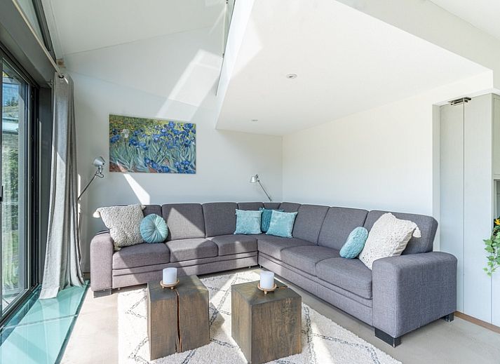 Enjoy the serene garden surrounding Duynzoom Villa 5, a vacation home in De Koog, Texel, perfect for a relaxing stay.