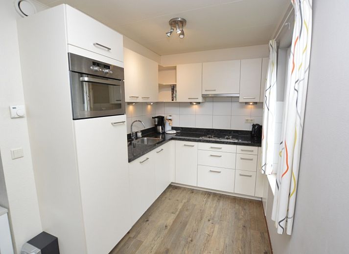 Cozy living room of Holiday home Stappeland 76 in De Koog, Texel with comfortable seating area.