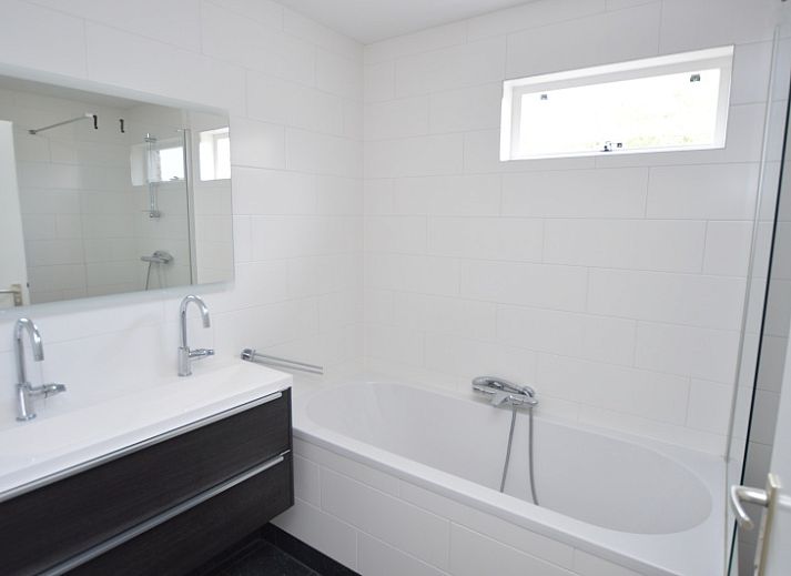 Cozy living room of Holiday home Stappeland 76 in De Koog, Texel with comfortable seating area.