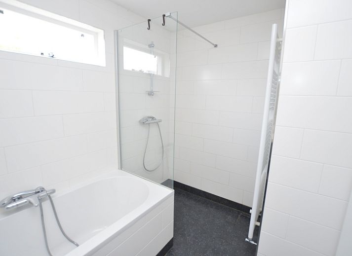 Cozy living room of Holiday home Stappeland 76 in De Koog, Texel with comfortable seating area.