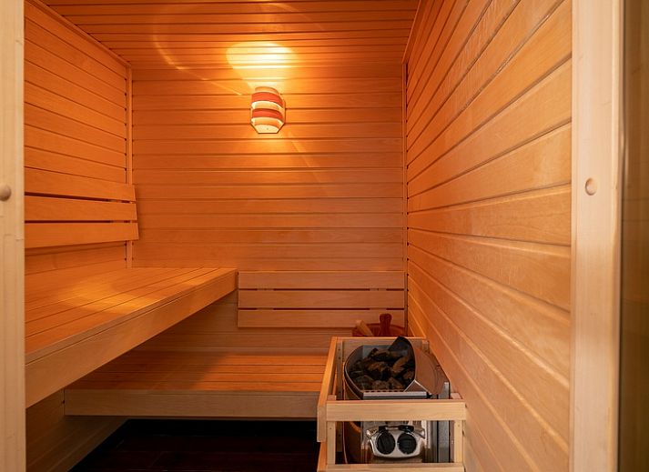 Bright living room of Apartment Juliana 034 Eilandzicht, De Koog, Texel with spacious seating area and access to the terrace.