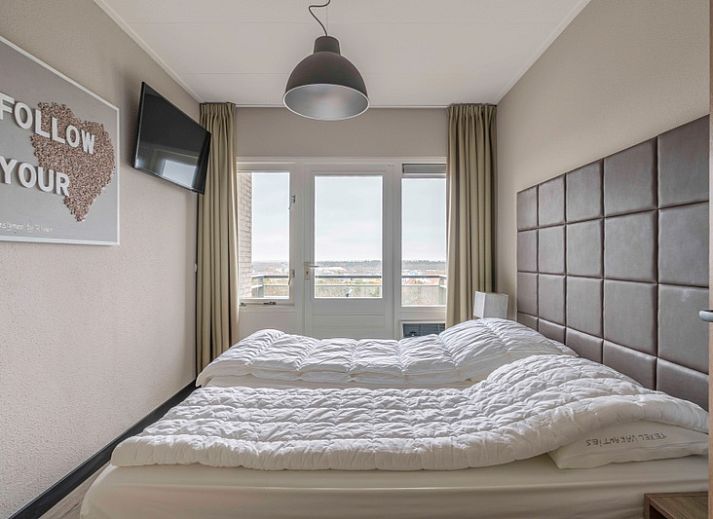 Gemuetliche Sitzecke im Appartement Juliana 174 Eilandzicht, De Koog, Texel, mit Blick auf die Natur.