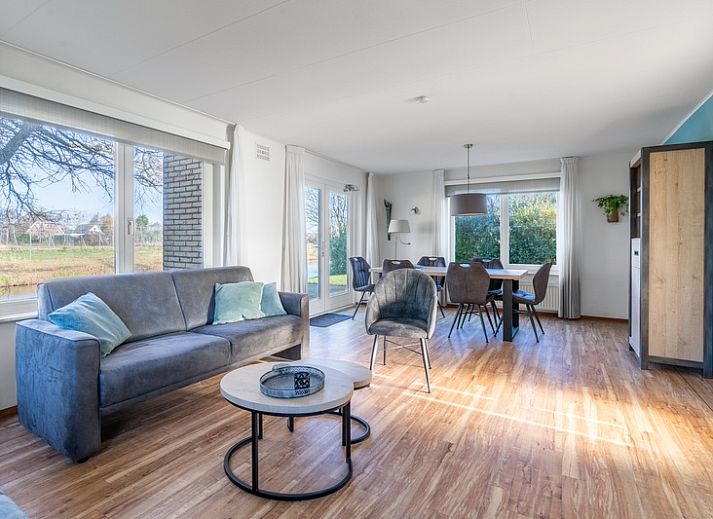 Cozy vacation home Honeysuckle 47 in De Koog, Texel with green surroundings and water feature.