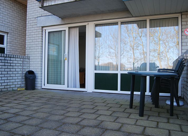 Spacious terrace of Apartment Dorpsstraat 245 in De Koog, Texel overlooking nature.