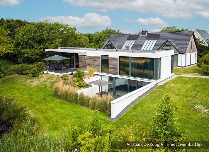 Luxury family villa with pool in De Koog, Texel. Modern architecture surrounded by lush nature on the Wadden Islands.
