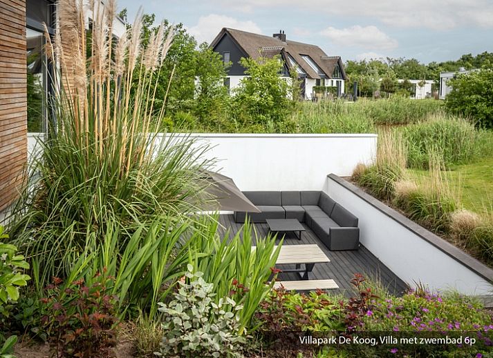 Terrace of the luxury family villa with pool in De Koog, Texel. Enjoy the view of the Wadden Islands.