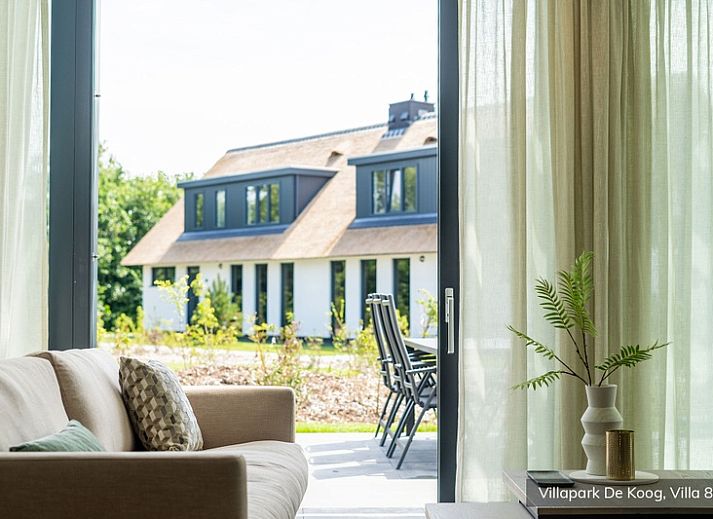 Luxury family villa 8p in De Koog, Texel with modern architecture and waterfront terrace.