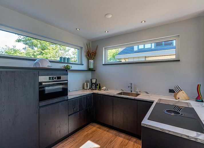 Gemuetliches Ferienhaus 38 - 14A Tureluur in De Koog, Texel mit sonnigem Garten und Terrasse.