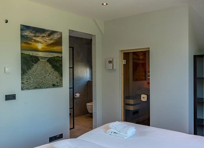 Gemuetlicher Aussenbereich mit Sonnenschirm im Ferienhaus 35 - 8A Blauwborst - BLV Kleingarten Nr. 3 in De Koog, Texel.