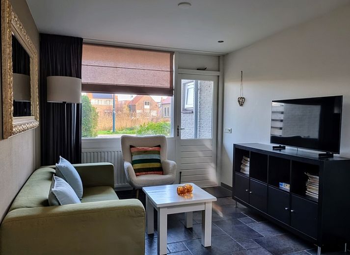 Gemuetliches Wohnzimmer im Ferienhaus 2 in De Koog, Texel mit komfortabler Sitzecke.