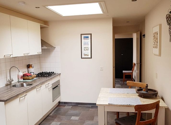 Gemuetliches Wohnzimmer im Ferienhaus 2 in De Koog, Texel mit komfortabler Sitzecke.