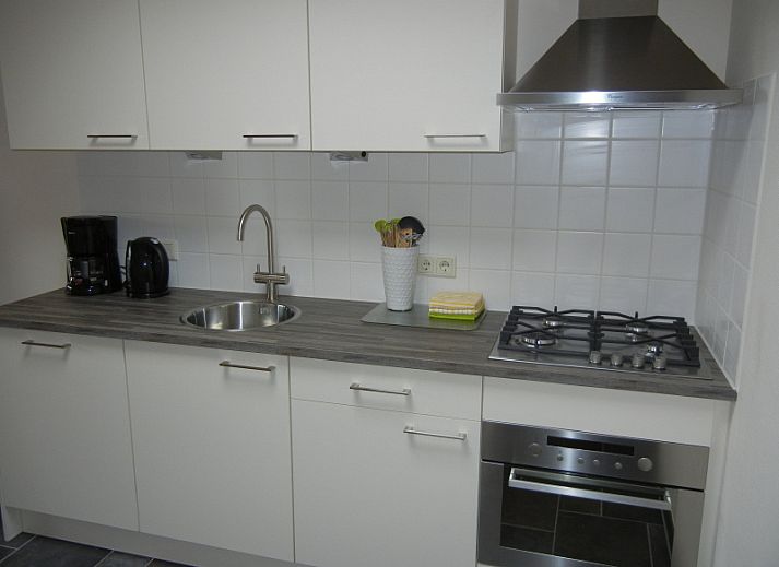 Gemuetliches Wohnzimmer im Ferienhaus 2 in De Koog, Texel mit komfortabler Sitzecke.