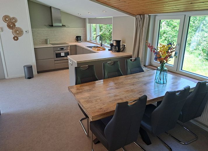 Vacation home Hoog Koog 10 in Bungalowpark Hoog Koog, De Koog, Texel with spacious outdoor area and seating.
