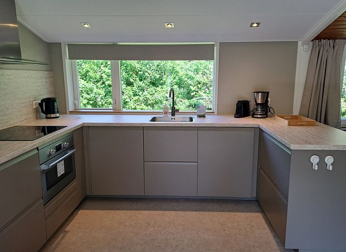 Vacation home Hoog Koog 10 in Bungalowpark Hoog Koog, De Koog, Texel with spacious outdoor area and seating.